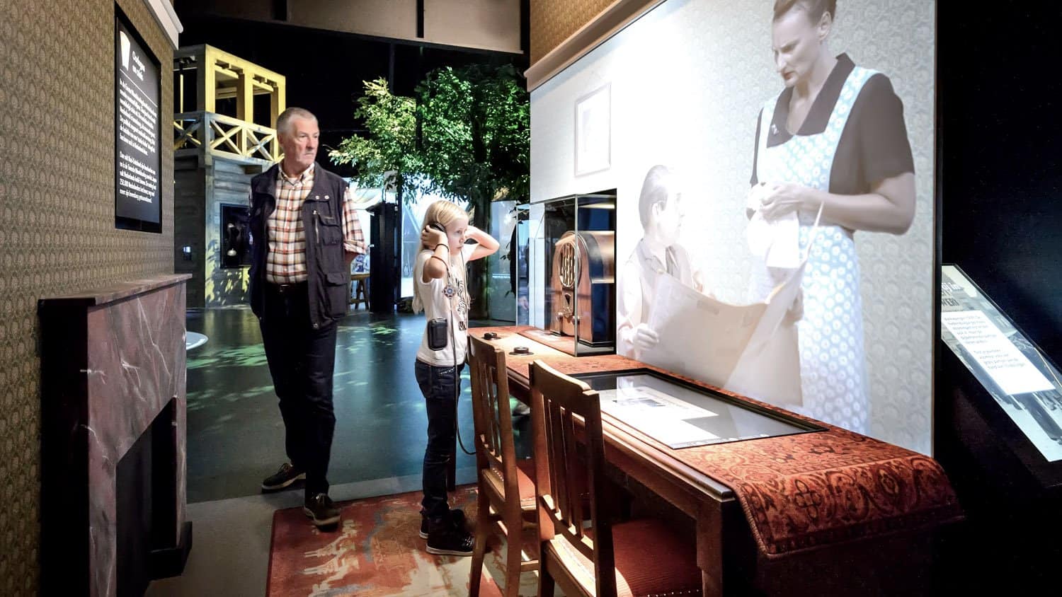 Visitor using AutoPlay Single Cup Headphones at Holland Open Air Museum, Netherlands