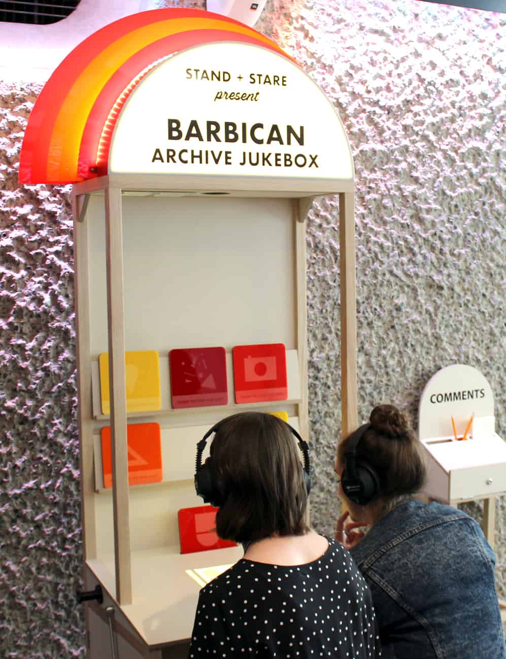 Two Visitors using MKII Headphones at Barbican Archive Jukebox