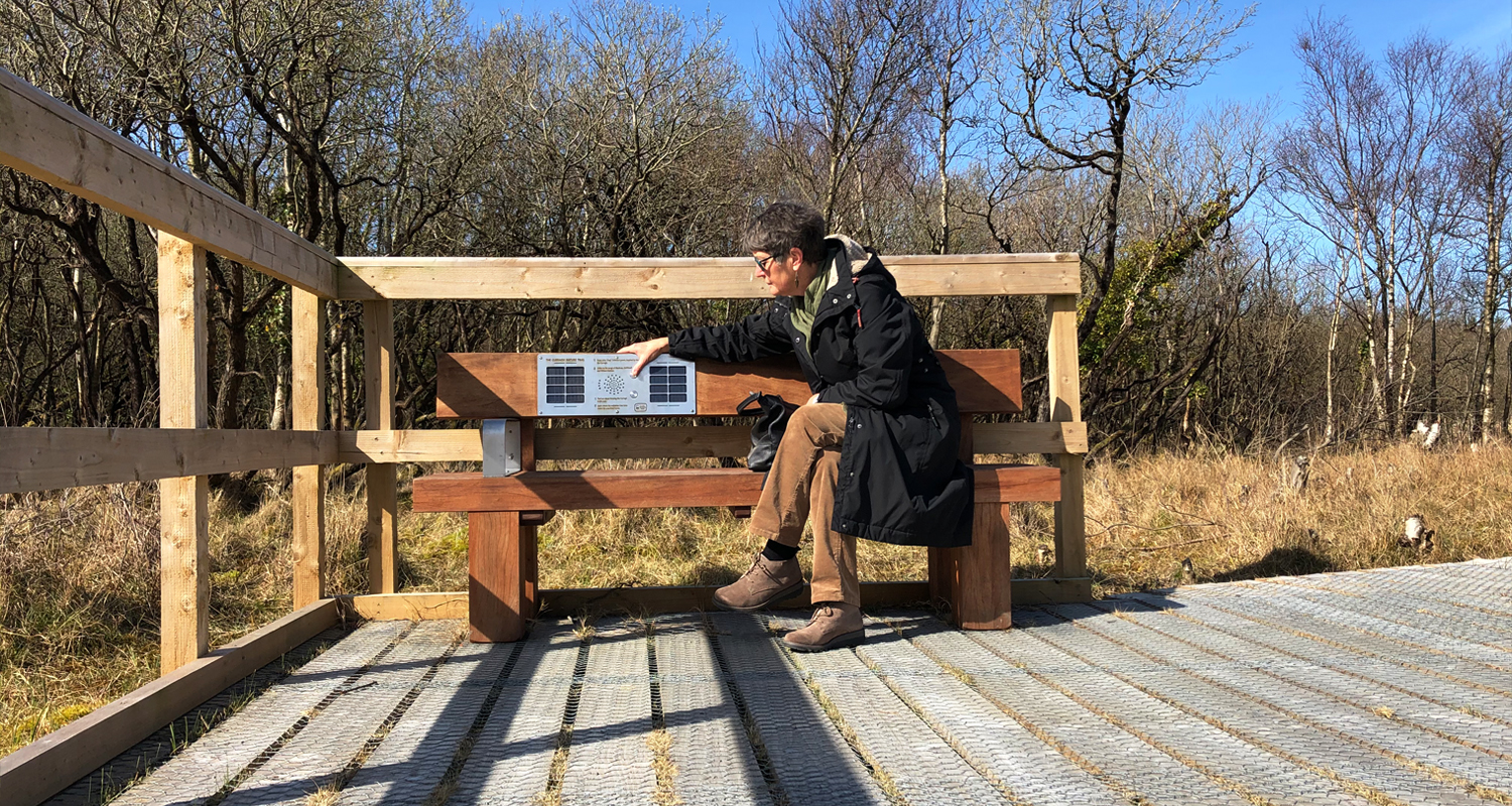 Person sitting on Heavy Duty Audio Bench at Curraghs Wildlife Park