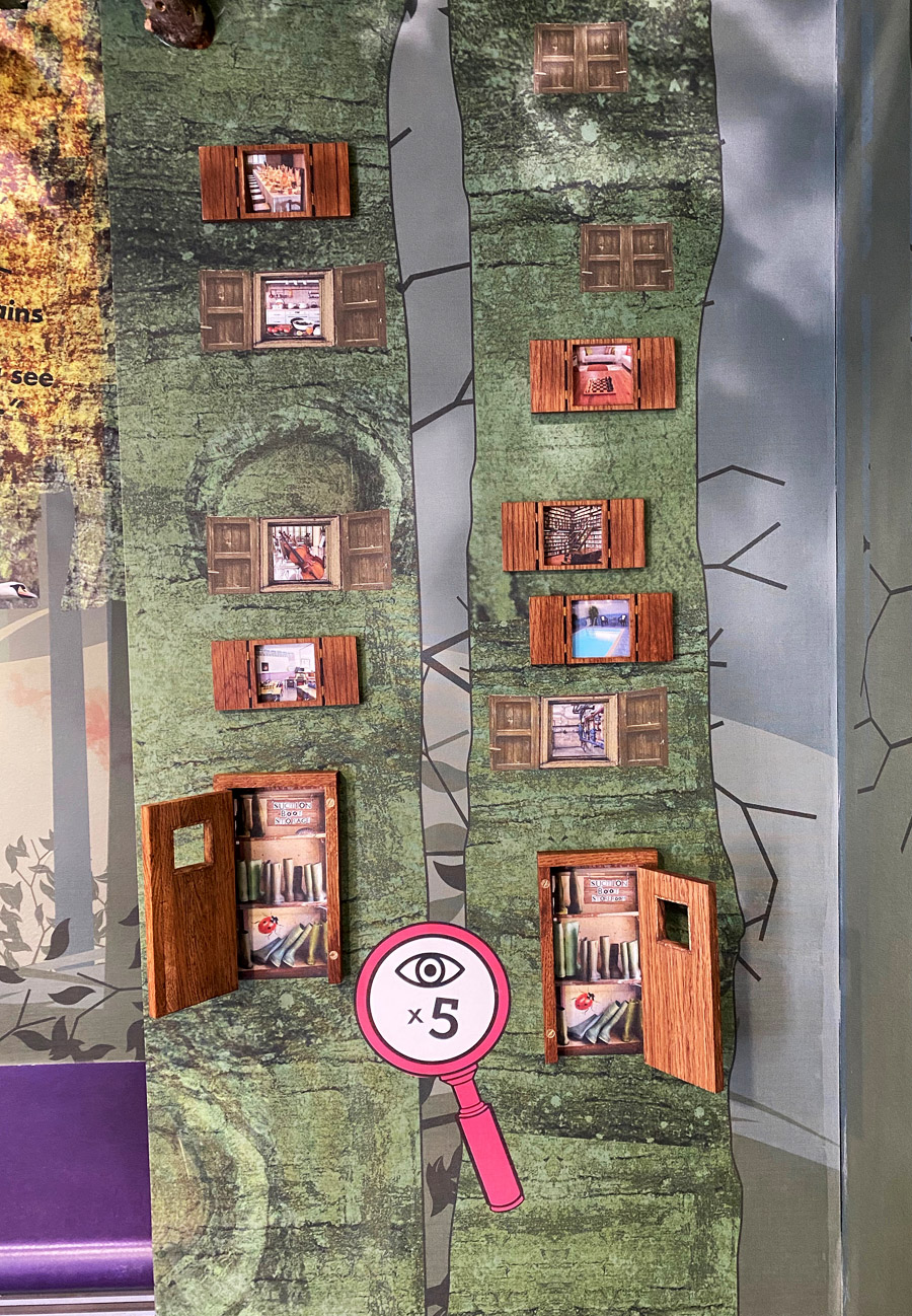 Tree trunk corner with open doors at Roald Dahl Museum