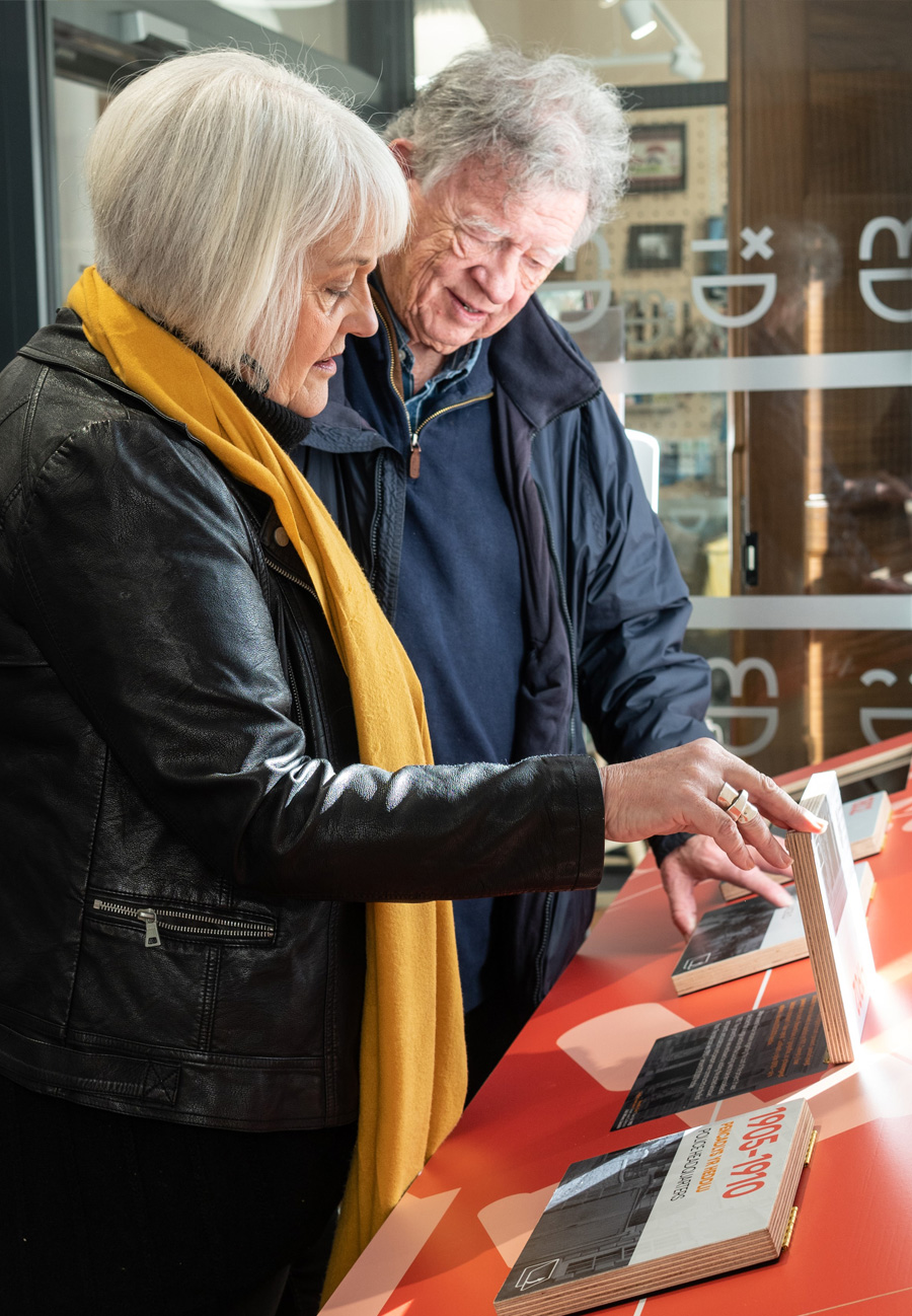 Couple interacting with timeline at Llandeilo Heritage Centre