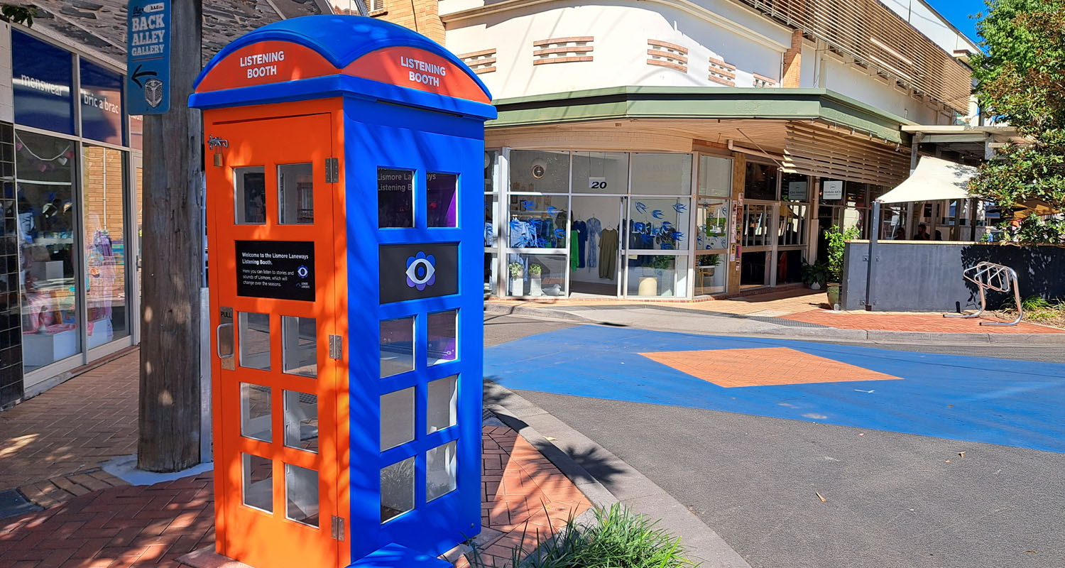 Orange and blue listening booth on street corner in Lismore
