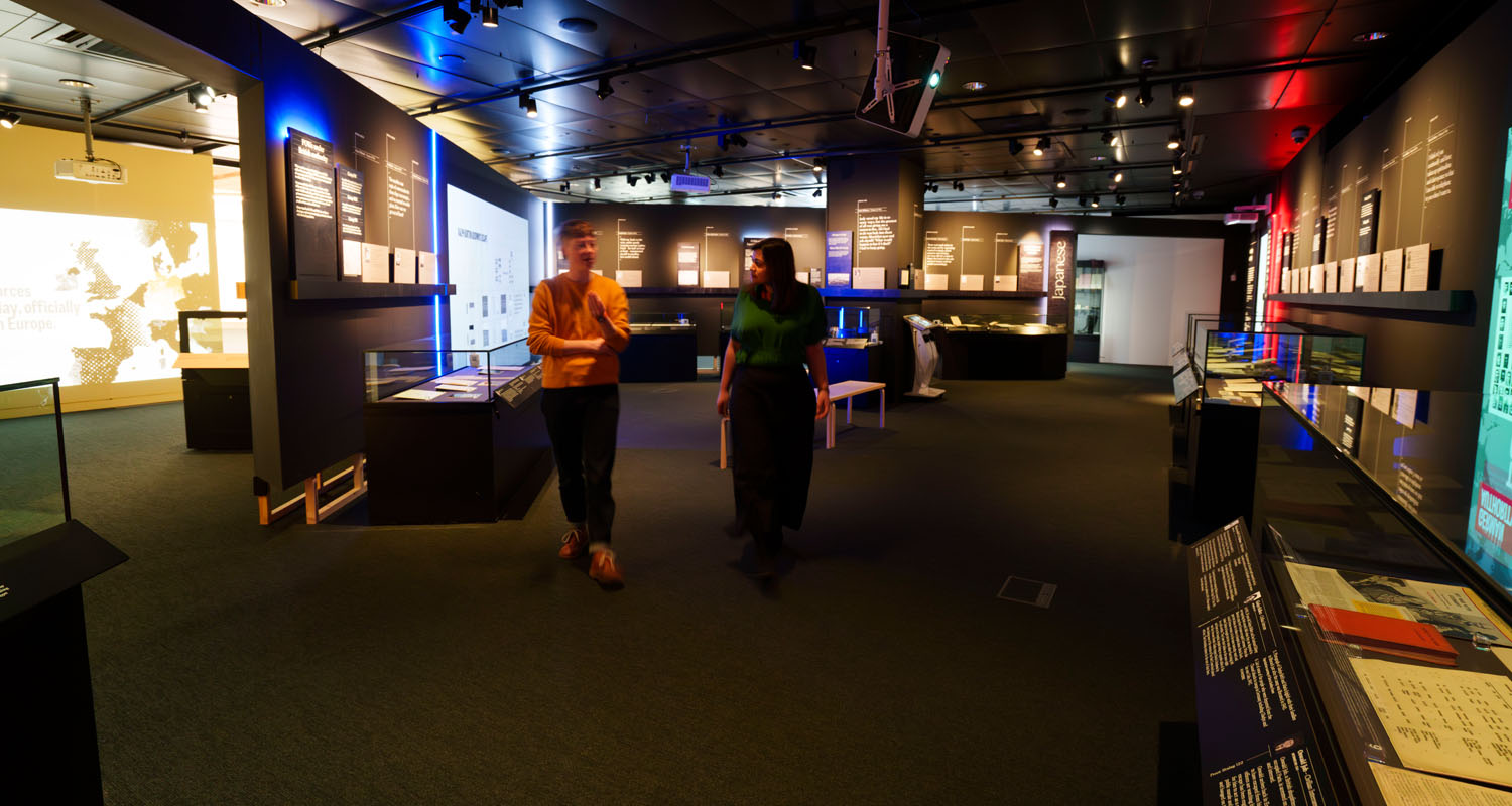 Wide shot of three projectors in use at National Archives' Great Escape exhibition