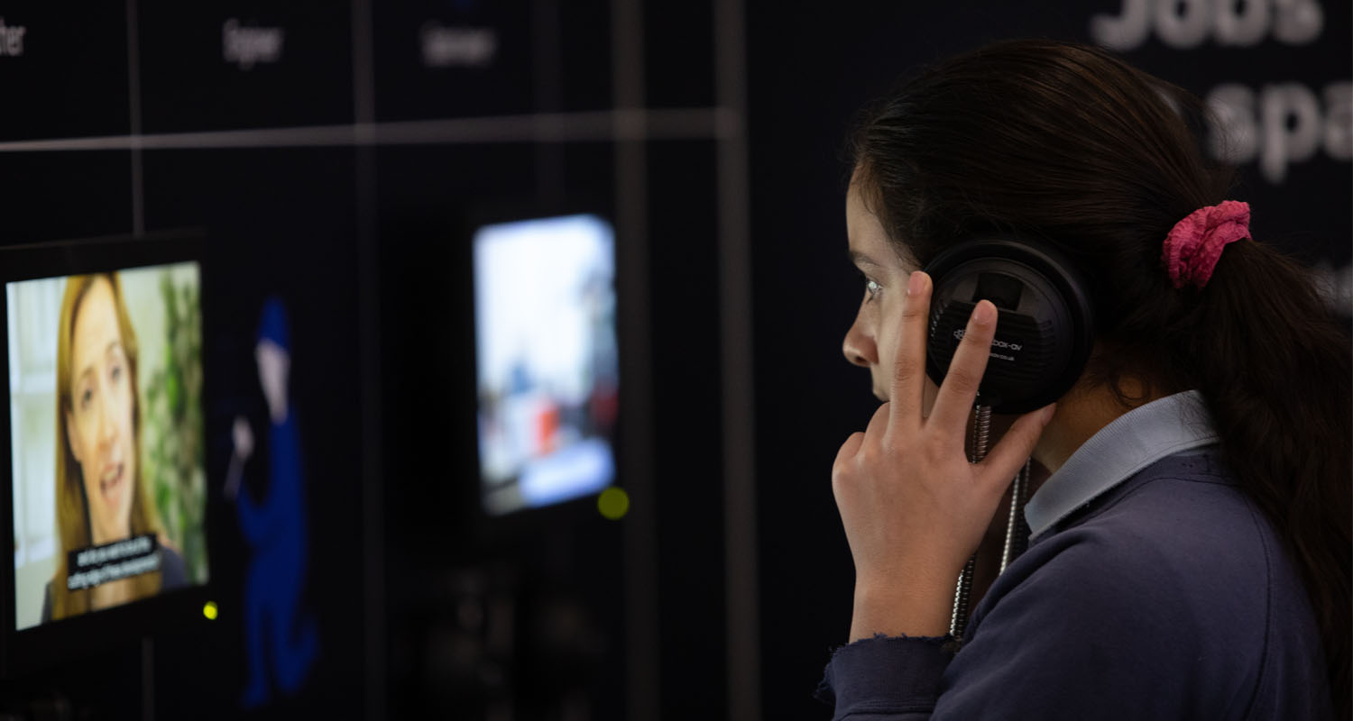 Single Cup Headphone in use with screen at the Life Science Centre