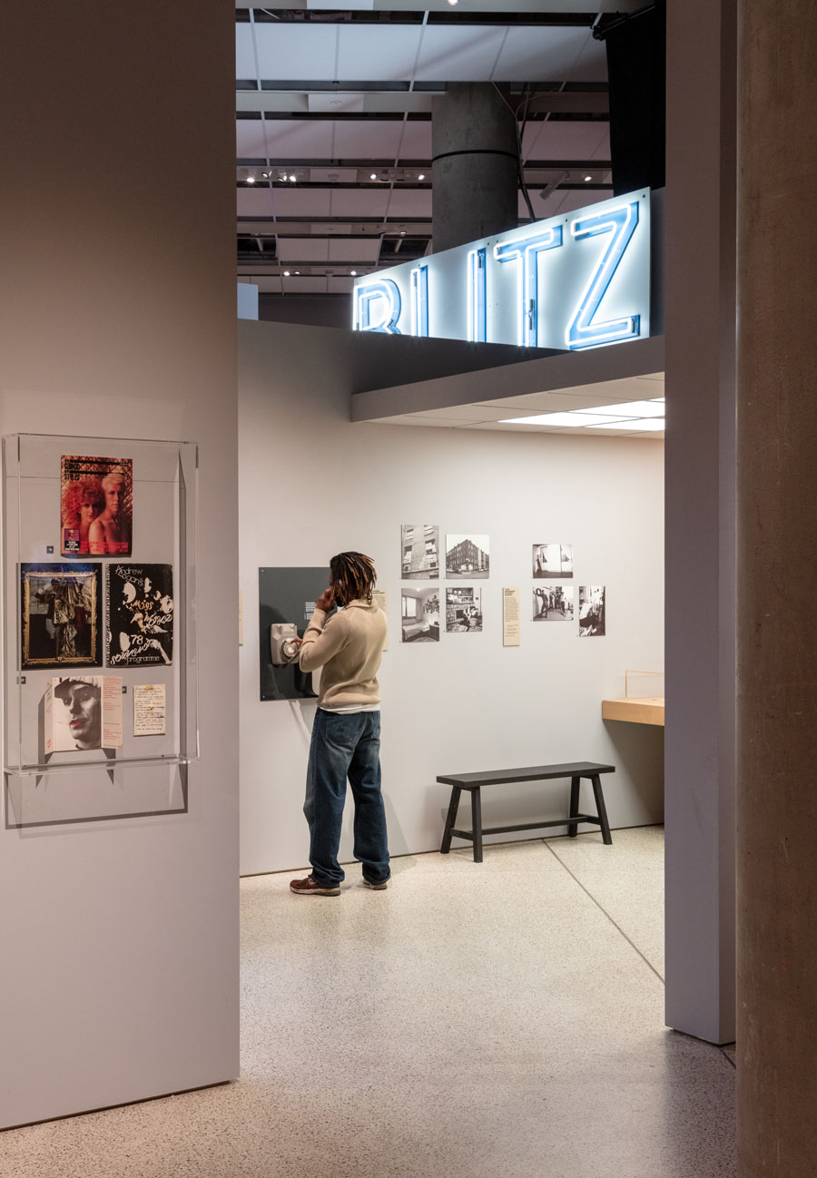 Period Telephone audio point in use at The Design Museum (portrait)