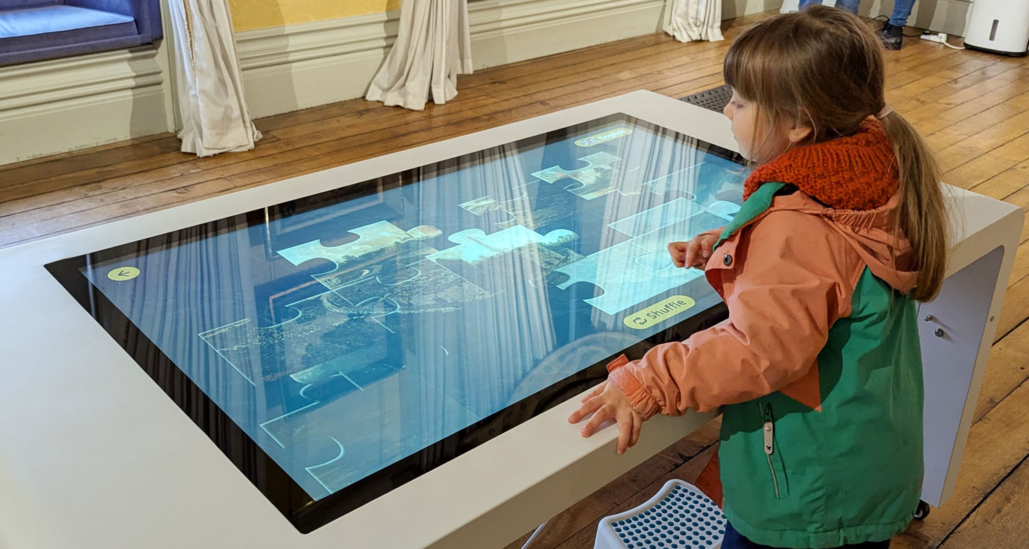 Touchscreen Table with Lightbox 3 in use at Cyfarthfa Castle
