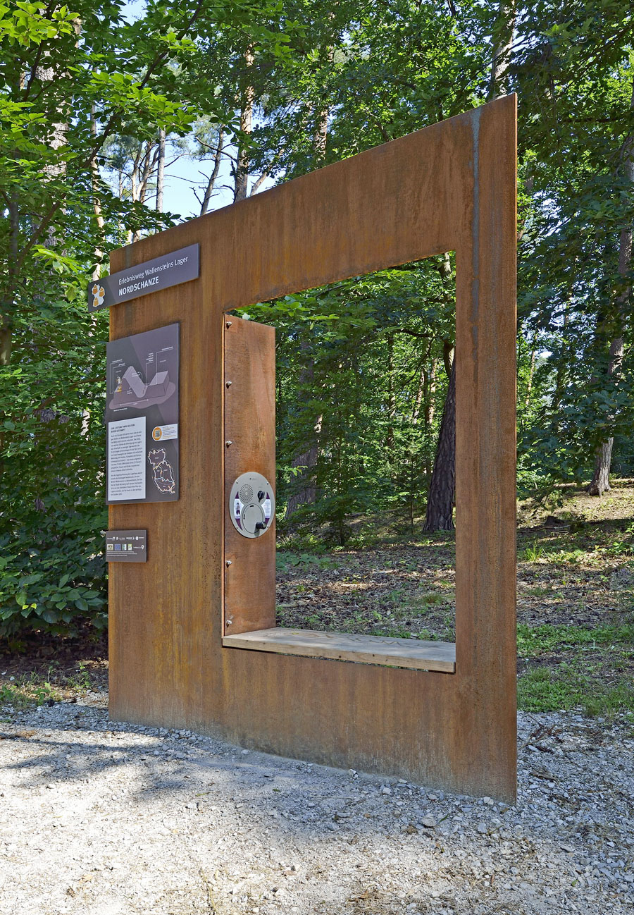 Oversized U-Turn Round installed in a bespoke stelae at Stein Wallenstein's Camp Adventure Trail (portrait)