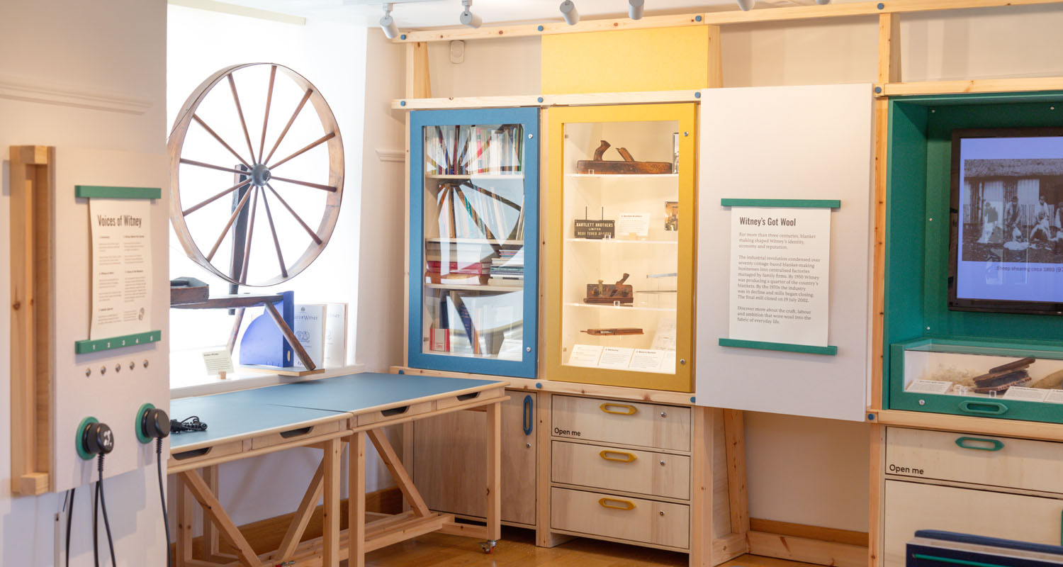 Listening Post with Handsets alongside a screen at Witney and District Museum - Work Form
